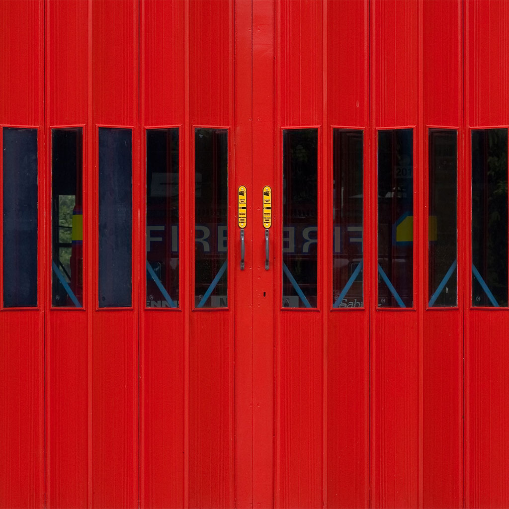 fire truck behind red doors