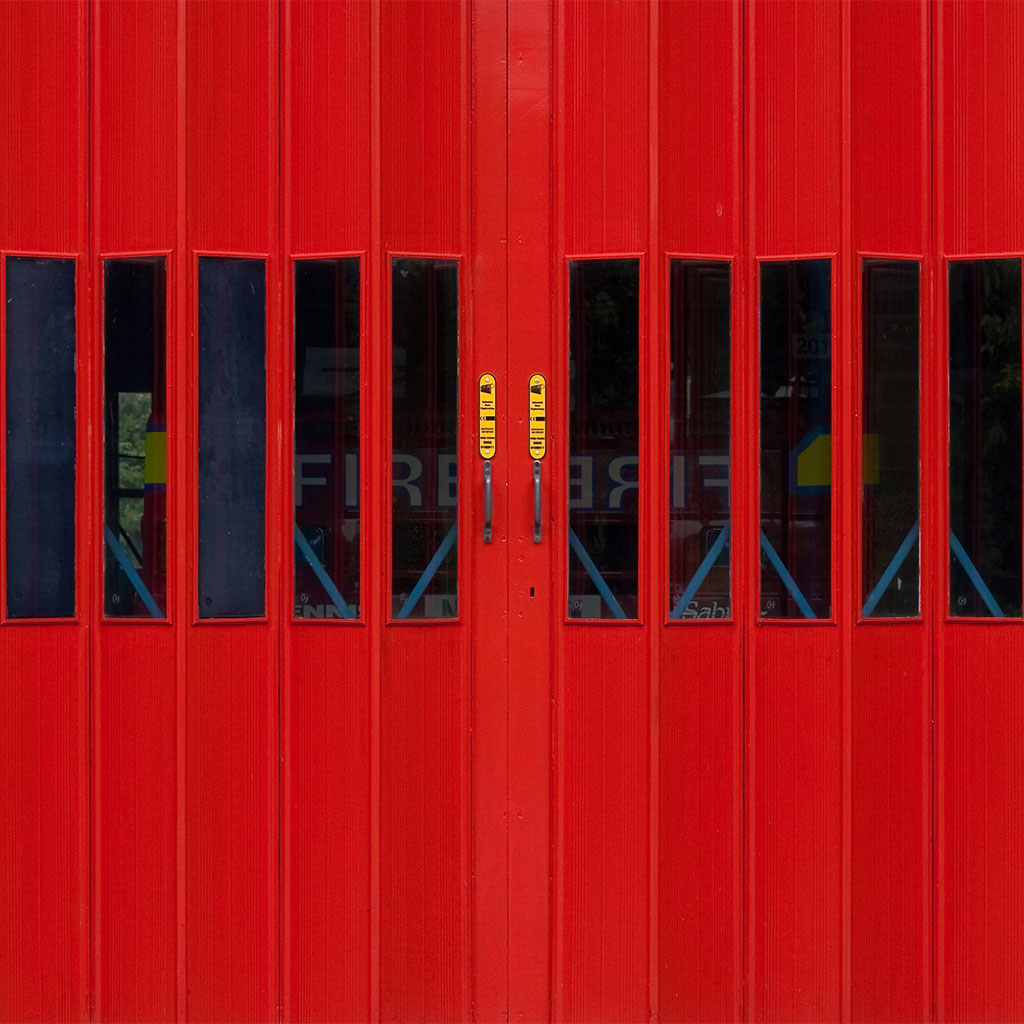 fire truck behind red doors