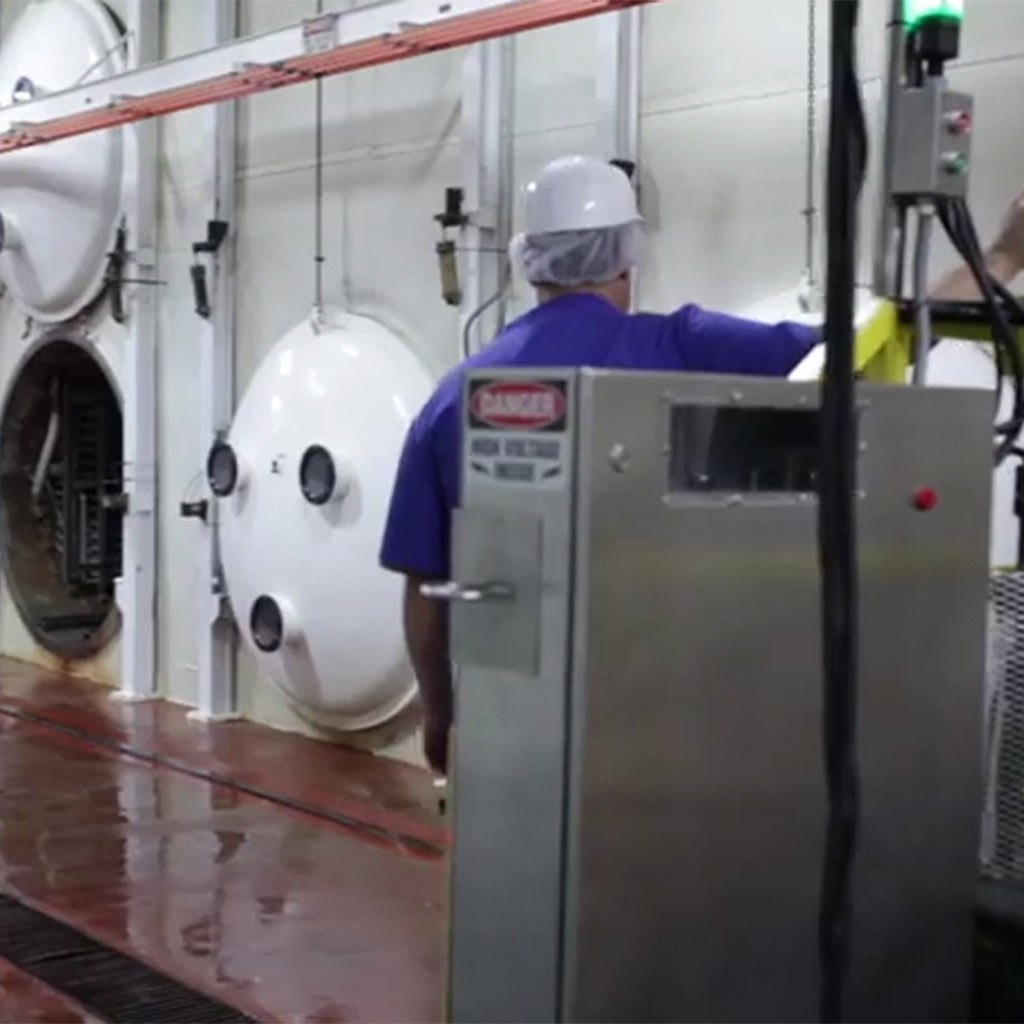 guy standing next to freeze dry chambers