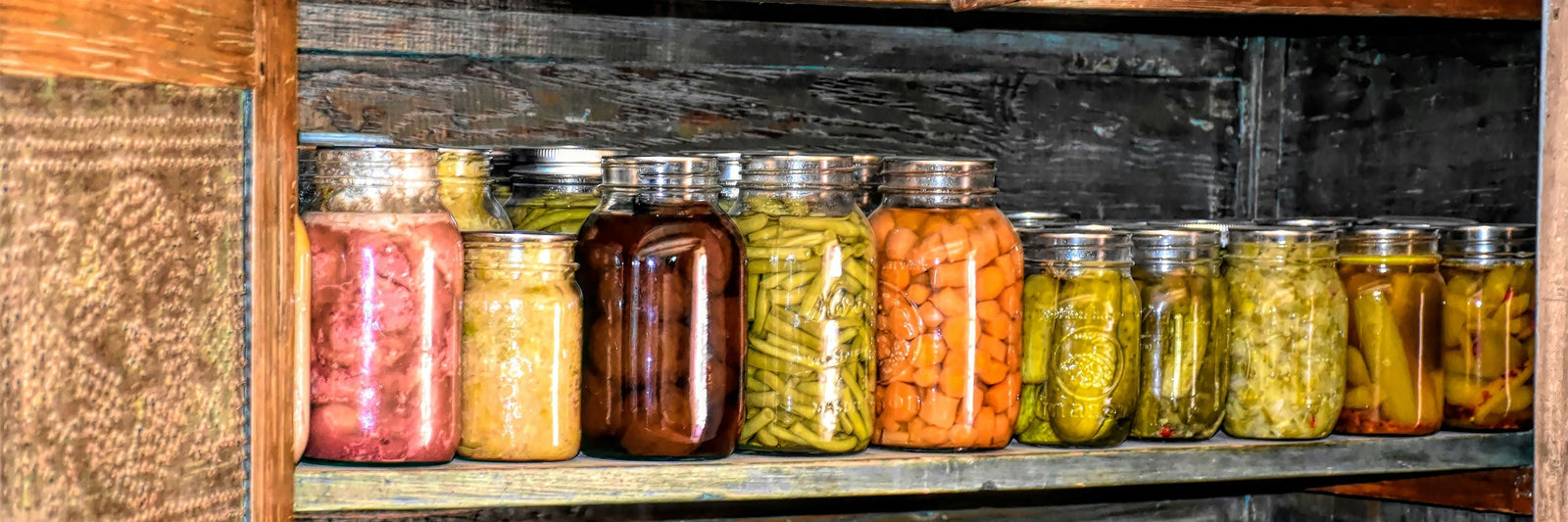 Glass jars filled with preserved food items for emergencies