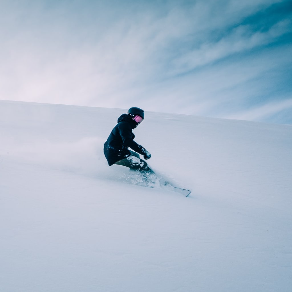 Man snowboarding.