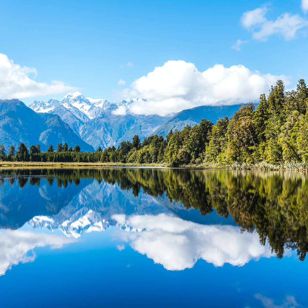 mountain lake under bright blue skies