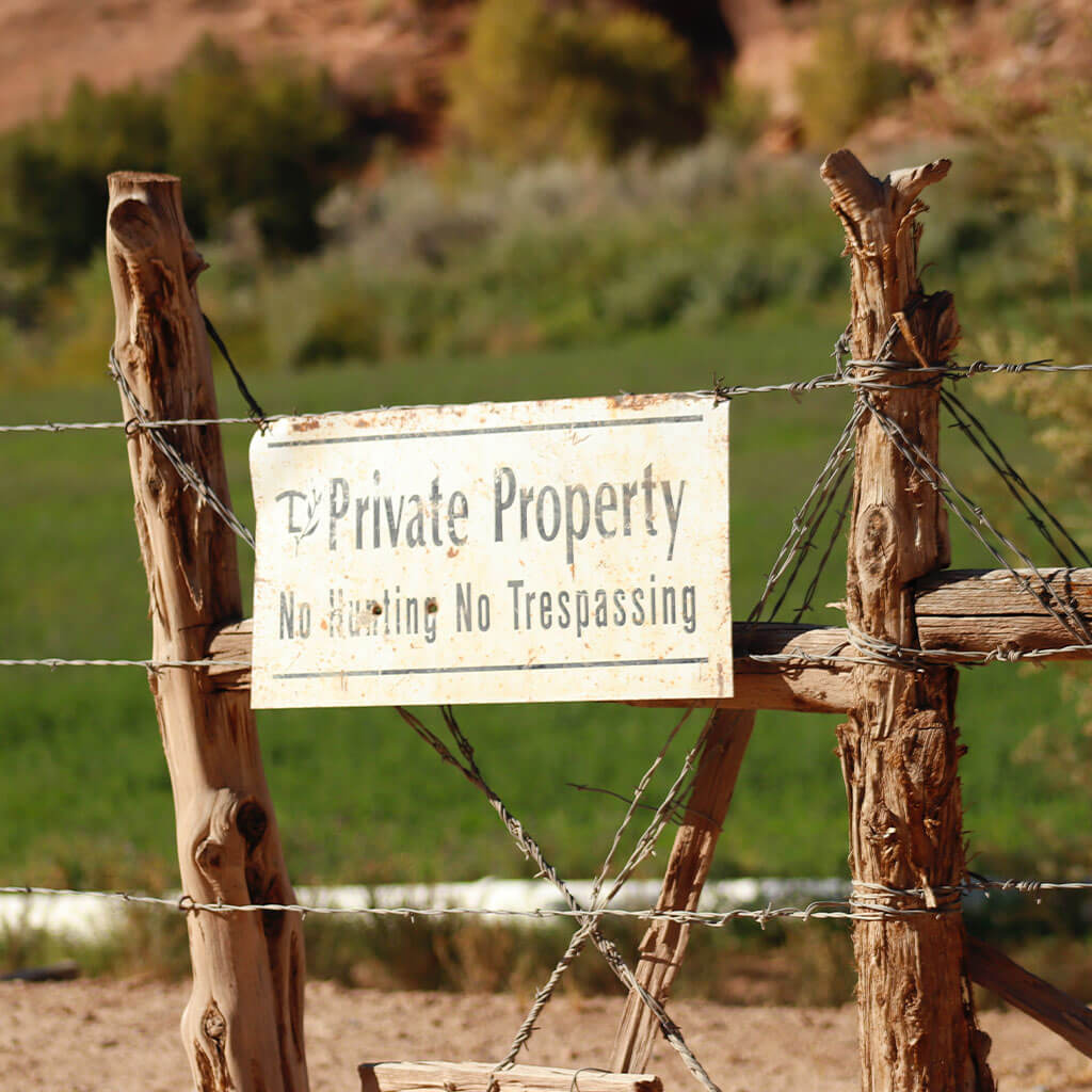 Private property sign posted on fence