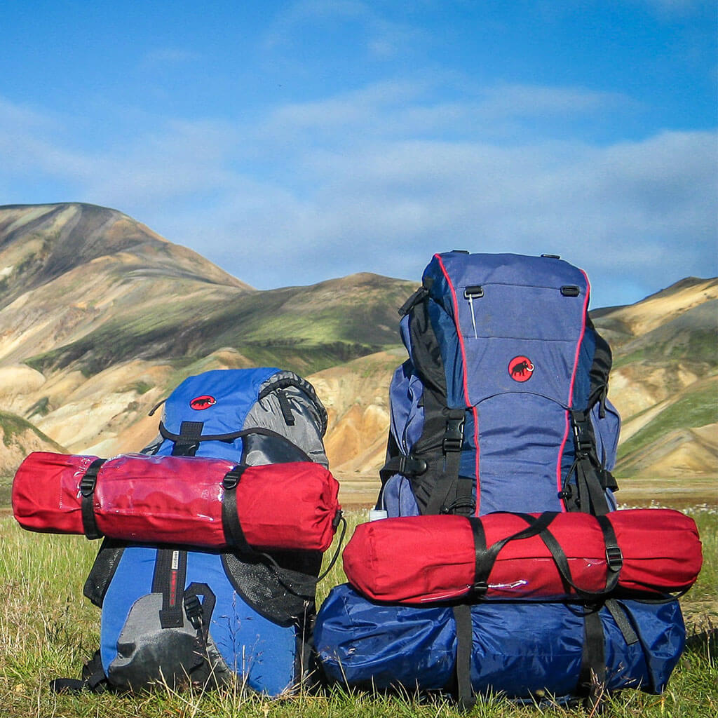 two loaded hiking backpacks