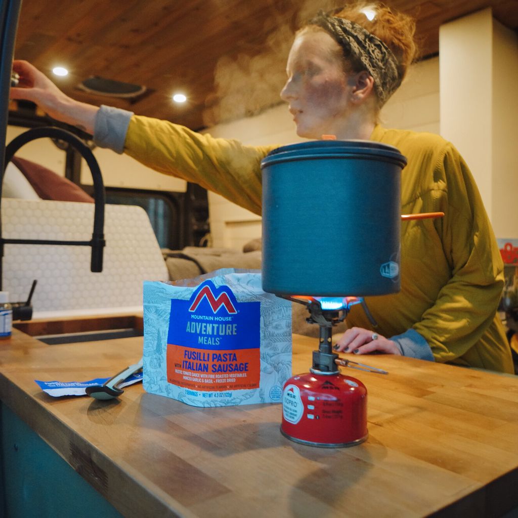 Van dweller cooking meal