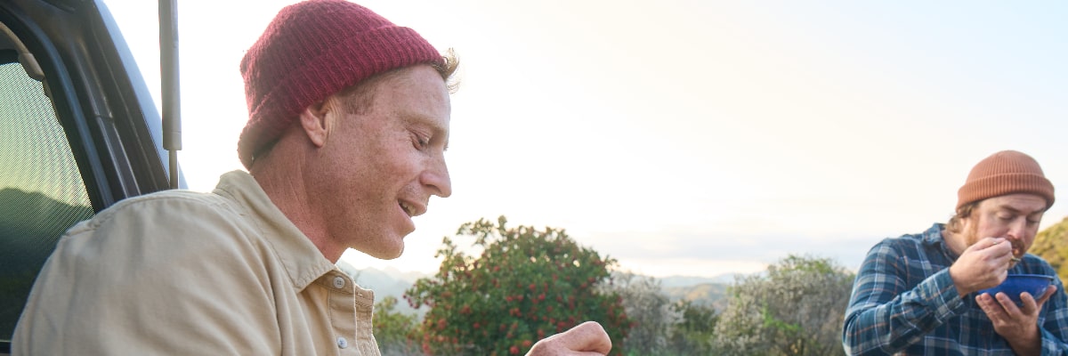 Campers enjoying healthy freeze-dried Mountain House meals.