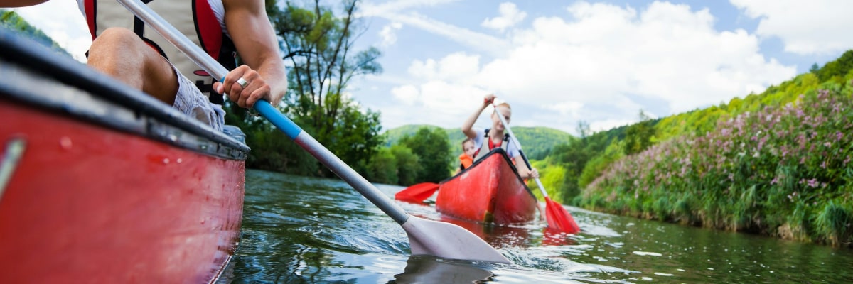 Family canoeing down the river.