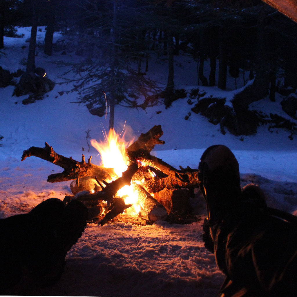 fire outside of tent in winter