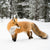 A fox hunting during a cold winter.