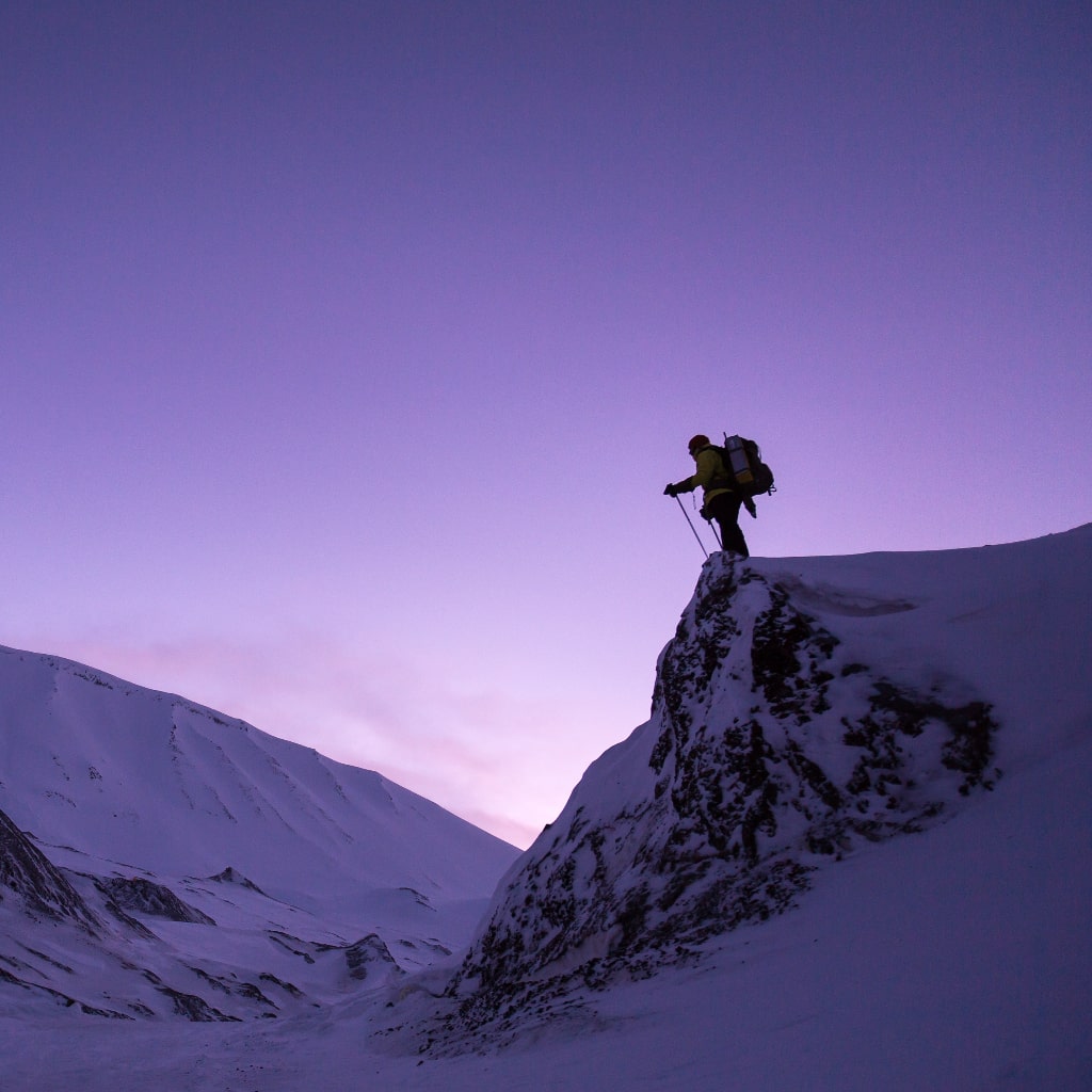 Mountaineer climbing the summit.