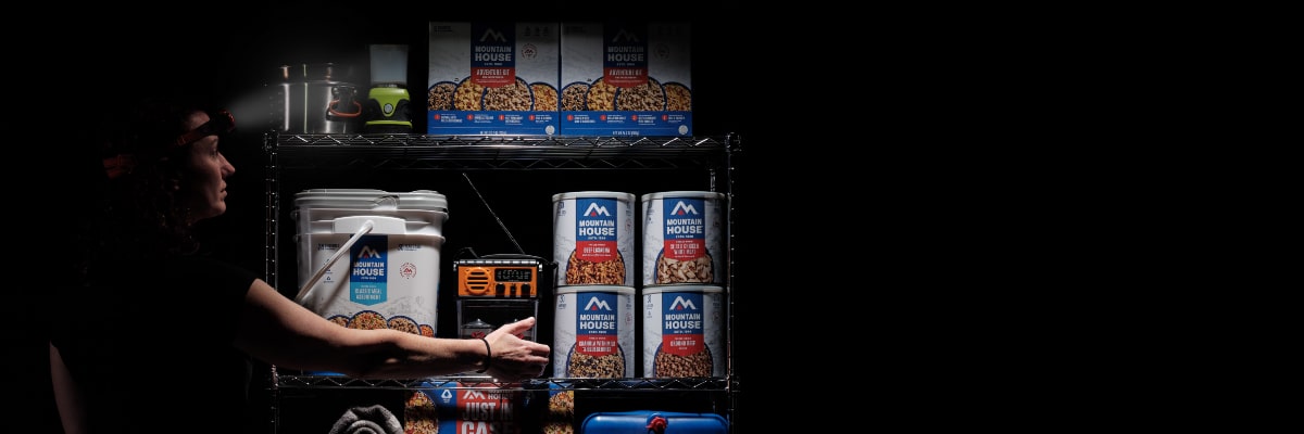 Woman rotating emergency food with the FIFO method.
