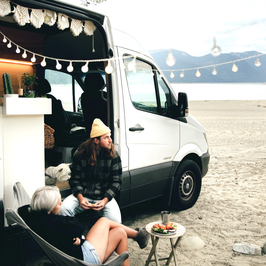 Van lifers relaxing on the beach.