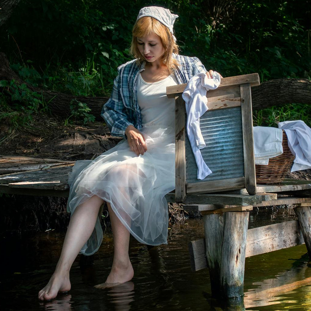articles/woman-washing-clothes-by-hand-featured-image.jpg