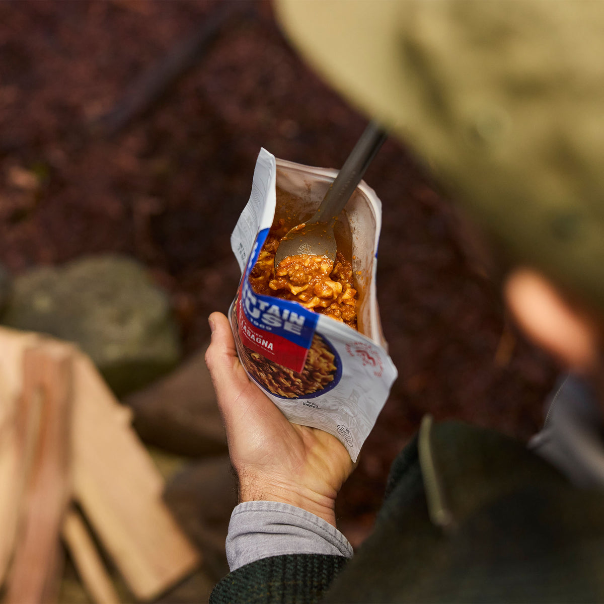 Close-up of inside of Mountain House Beef Lasagna when prepared in hands of a camper at a campground.