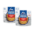 Front view of two Mountain House Creamy Mac & Cheese pouches.