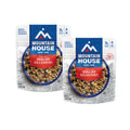 Front view of two Mountain House Granola with Milk & Blueberries pouches.
