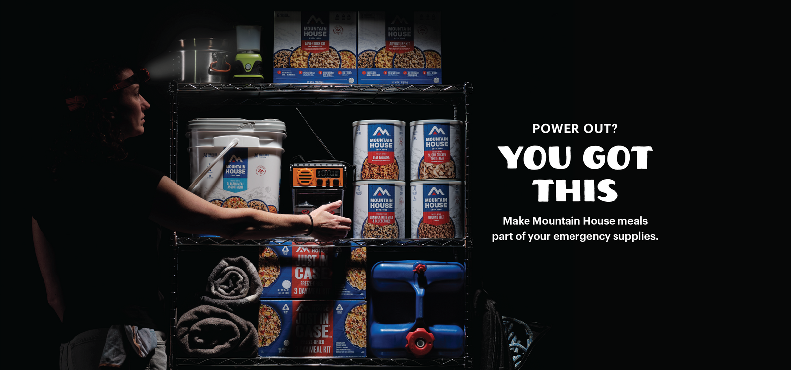 Person reaching for emergency supplies during a power outage. Text reads, "Power Out? You Got This. Make Mountain House meals part of your emergency supplies."