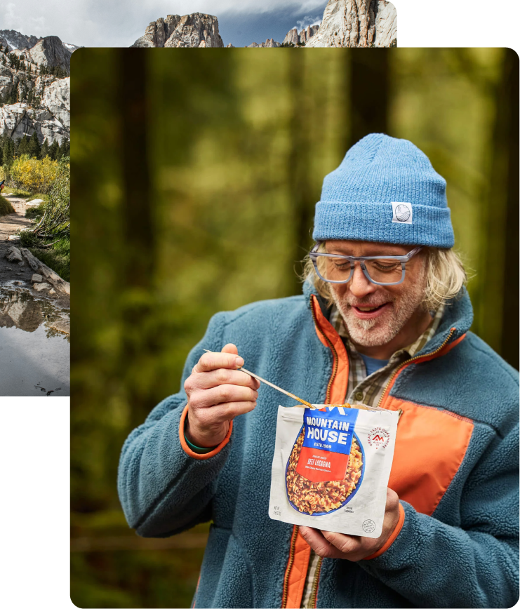 Hiker on a mountain trail with a scenic view and a person eating from a Mountain House food pouch in the forest.