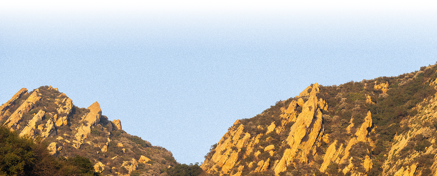 Scenic photo of mountain tops covered with vegetation