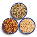 Three blue camping bowls filled with various Mountain House meals