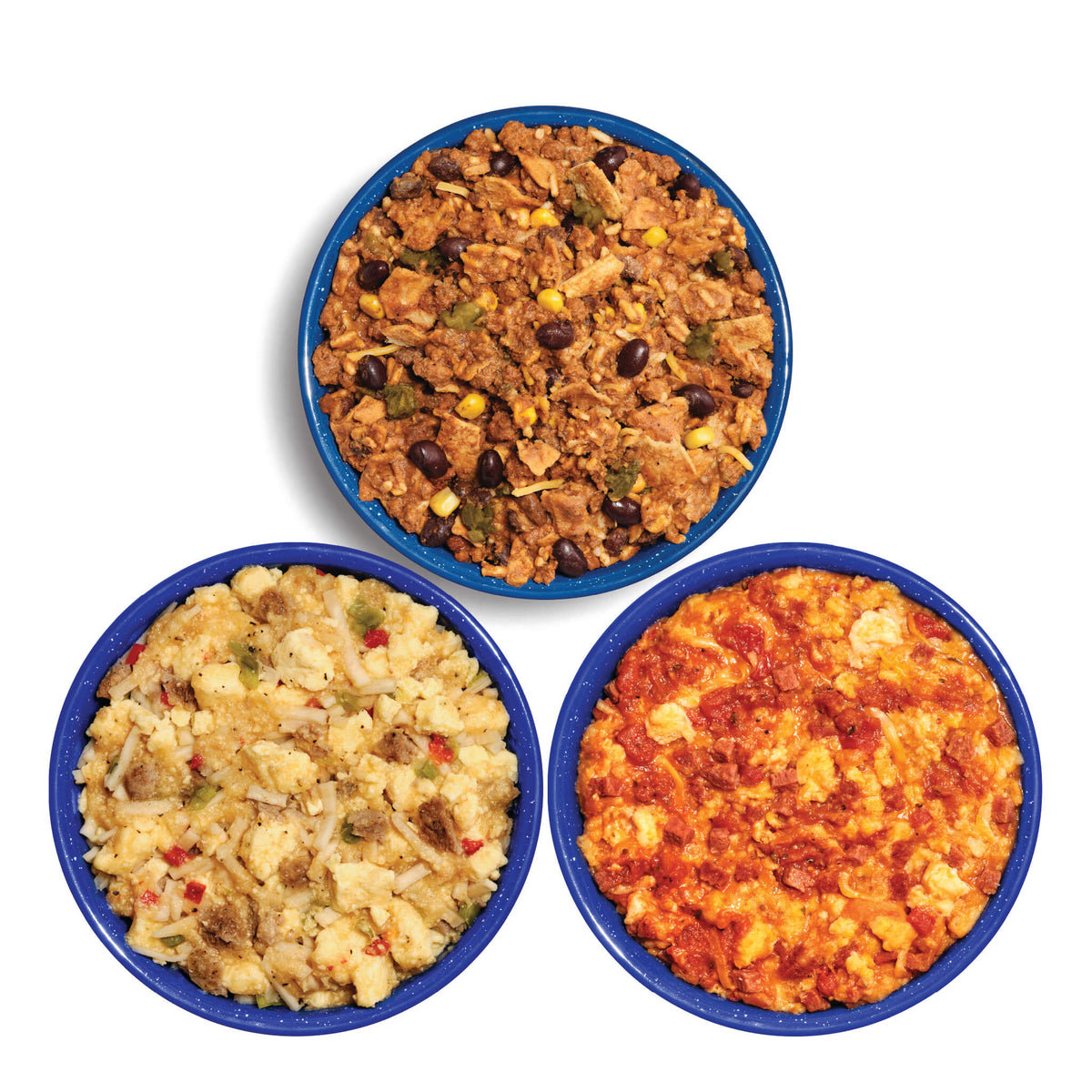 Three blue bowls filled with different types of Mountain House food on a white background