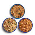 Three blue camping bowls filled with takeout inspired meals.